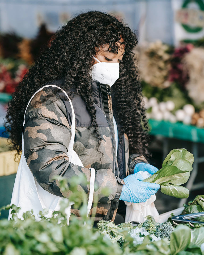 Woman wearing a mask while shopping for food
